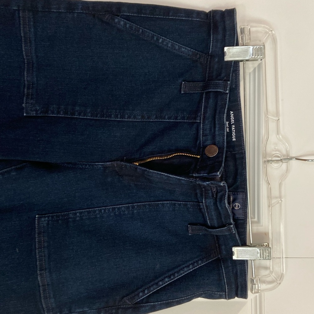 Never worn. Tags removed. Fatigue style pockets - boot cut dark denim.